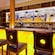 The Bon Voyage bar has an art mural above the bar and high backed barstools